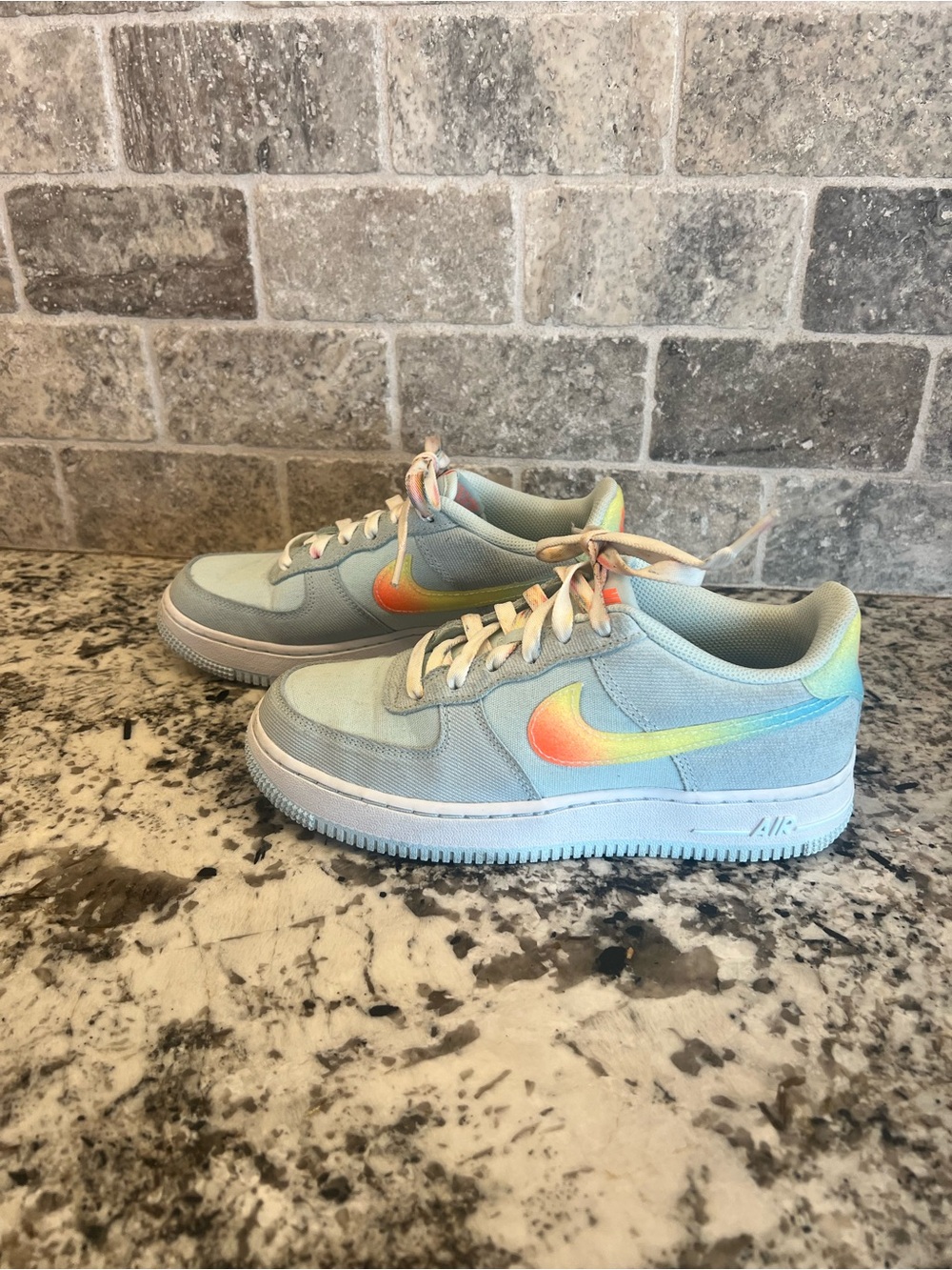 Nike Light Blue Low-Top Sneakers with Pastel Rainbow Swoosh